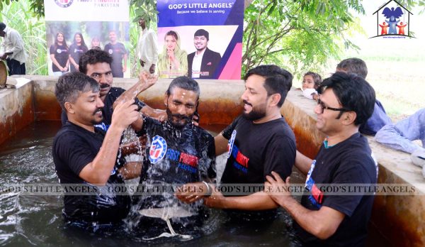 Believers being baptized after confessing and repenting, guided by Pastor Shahzaib Zafar under God’s Little Angels Ministry in Pakistan